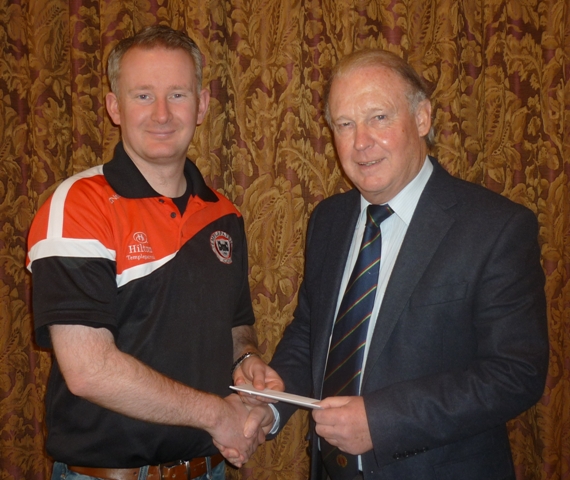 Brian Walsh, Chairman of the NCU (right), presents Peter Shepherd with the prize of two tickets for Ireland versus England after winning the competition to name the NCU Inter-provincial limited overs cricket team.